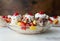 Banana splits on a vintage white table, close up view from the side. Stained wood background. Room for copy.