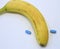 Banana with two blue pills for male problems