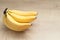 Banana on the wooden background. A banch of bananas over a wooden table