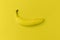 Banana on yellow background. Modern food background