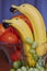 Bananas as dolphins with a dark grape in the mouth