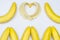 Bananas and banana heart on white