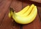 Bananas on dark wood background with copyspace