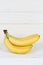 Bananas fruit fruits portrait format copyspace on wooden board