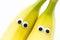 bananas with googly eyes on white background