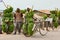 Bananas, heavy load on bikes in Uganda. Boy and man carrying loads on bikes. Bicycles loaded with cooking bananas and bags