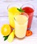 Bananas, strawberry and oranges slice, juice in glass