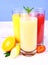 Bananas, strawberry and oranges slice, juice in glass