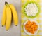 Bananas on table, cottage cheese and dried apricots on napkin