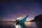 Banca boat at Corong beach illuminated in twilight lit by last sunset light, El Nido, Palawan, Philippines