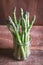 Banches of fresh green asparagus in a jar