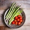 Banches of fresh green asparagus on wooden background