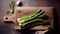 banches of fresh green asparagus on wooden background, top view