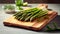 banches of fresh green asparagus on wooden background, top view