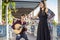 Band performing traditional music fado under pergola with azulejos in Lisbon, Portugal