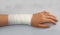 Bandaged arm of a child because of a lesion