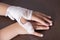 Bandaged woman`s hand, hand injury, bandage bandage