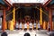 Bandung, Indonesia - January 8, 2022 : Buddhist People pray together with the monks while giving the offering in front of the