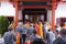 Bandung, Indonesia - January 8, 2022 : Buddhist People pray together with the monks while giving the offering in front of the