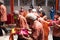 Bandung, Indonesia - January 8, 2022 : The man united together for brings the offering to the monks and god on the altar while