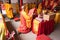 Bandung, Indonesia - January 8, 2022 : The Monks with orange clothes pray together in front of the altar