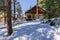 BANF, CANADA - MARCH 20, 2020: vacation cabins in winter park between trees in Johnston canyon