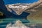 Banff, Canada - Ago 19th 2017 - Tourists doing kayak and enjoying the amazing scenario of lake Moraine, early morning light, glaci