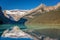 Banff, Canada - Ago 19th 2017 - Tourists doing kayak and enjoying the amazing scenario of lake Moraine, early morning light, glaci