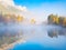 Banff National Park, Alberta, Canada. Fall. Landscape during sunrise. Autumn trees on the river bank. Mountains and forest.