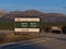 Banff National Park entrance sign in the Rocky Mountains at Trans-Canada Highway in the evening light.