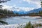 Banff Pedestrian Bridge and Bow River trail in snowy autumn day.