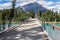 Banff Pedestrian Bridge and Bow River trail in summer sunny day. Banff National Park, Canadian Rockies