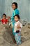 Bang Saen, Thailand: Little Girls Playing in Sand Pile