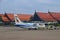 Bangkok Airways Public Company Limited passenger propeller aircraft with Siem Reap International Airport building in background