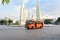 Bangkok - February 4, Traffic around Democracy Monument during the day. Orange mini bus in front of the scene,February 4, 2017 in