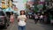 BANGKOK - JULY 16 : Timelapse view of asian tourist with map in her hand stand alone with many national tourist at Khao San road