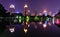 Bangkok night skyline and water reflection with urban lake in summer