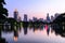 Bangkok skyline and water reflection with urban lake in summer