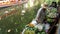 BANGKOK, THAILAND - 13 JULY 2019: Lat Mayom floating market. Traditional classic khlong river canal, local women farmers, long-