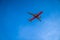 Bangkok, Thailand - 26 Sep 2020, the red yellow AeroPlane is flown in the open sky at afternoon time at Bangkok, Thailand