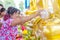 BANGKOK THAILAND - April 16, 2018: Songkran Festival, Woman use the water pouring to golden buddha statue. Songkran Festival is he