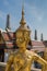 Bangkok, Thailand - April 21, 2015: Golden Kinnari statue outside Buddhist temple in Bangkok\'s Grand Palace complex, Thailand.