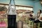 BANGKOK, THAILAND - APRIL 27, 2017: Half consumed Coca-cola glass bottle in a restaurant in a rural area.