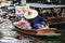 Bangkok Thailand. Boats on the canal selling fruits, foods for tourists in Damnoen Saduak floating market.