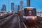 Bangkok, Thailand: BTS train arrives in Saphan Taksin station in evening