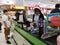BANGKOK, THAILAND - DECEMBER 31: Unidentified asian female cashier with santa hat female seller with bar code scanner scanning