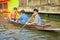 BANGKOK, THAILAND - FEBRUARY 09, 2018: Outdoor view of unidentified people paddling in a small boat sailing at yai canal