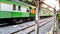 BANGKOK, THAILAND - FEBRUARY 15, 2018: The traditional Thai trains are sailing past the city center in the afternoon