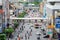 Bangkok, Thailand - July 21 2019: Many car cause traffic jams at Ratchaprarop Road have overpass. Many people walking on Sky Walk