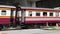 Bangkok, Thailand - July 28, 2019: The train is running through the road cut through the railroad.